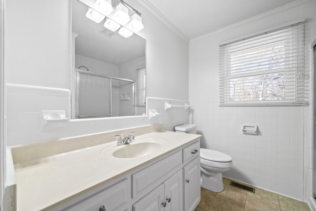 bathroom featuring crown molding, tile walls, tile patterned flooring, toilet, and a shower with shower door