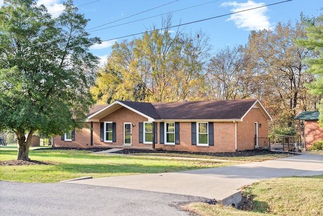 ranch-style house with a front yard