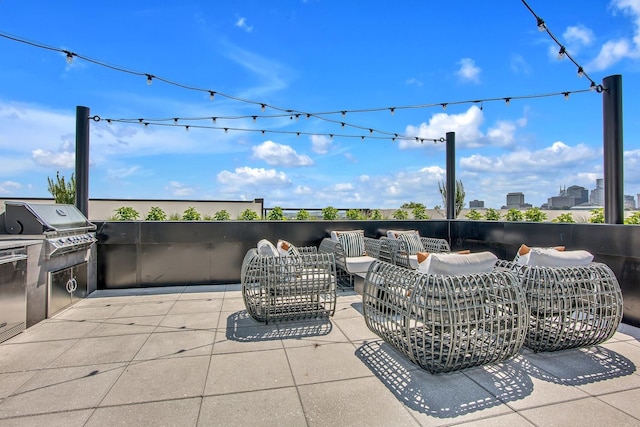 view of patio / terrace with an outdoor living space and a grill