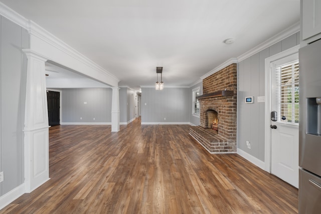 unfurnished living room with a fireplace, dark hardwood / wood-style floors, and ornamental molding