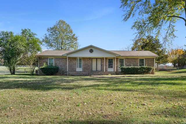 single story home featuring a front yard