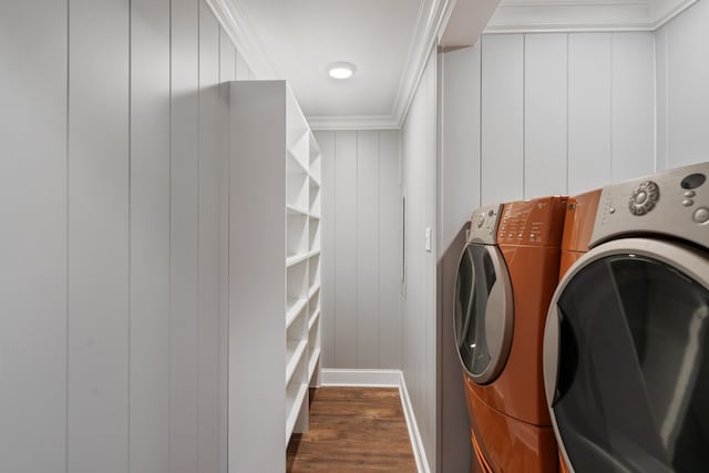 laundry room featuring independent washer and dryer, dark hardwood / wood-style flooring, and ornamental molding