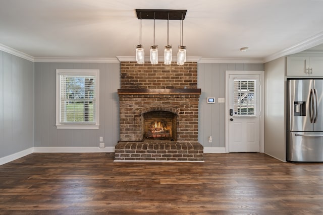 unfurnished living room with a fireplace, crown molding, and dark wood-type flooring