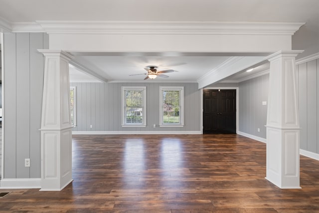 unfurnished living room featuring ceiling fan, ornate columns, dark wood-type flooring, and ornamental molding