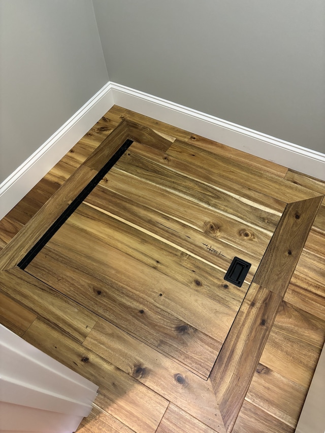 details with hardwood / wood-style flooring