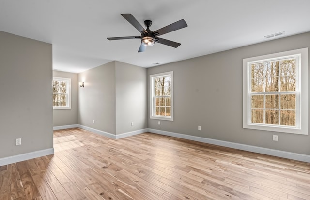 spare room featuring light hardwood / wood-style floors and ceiling fan