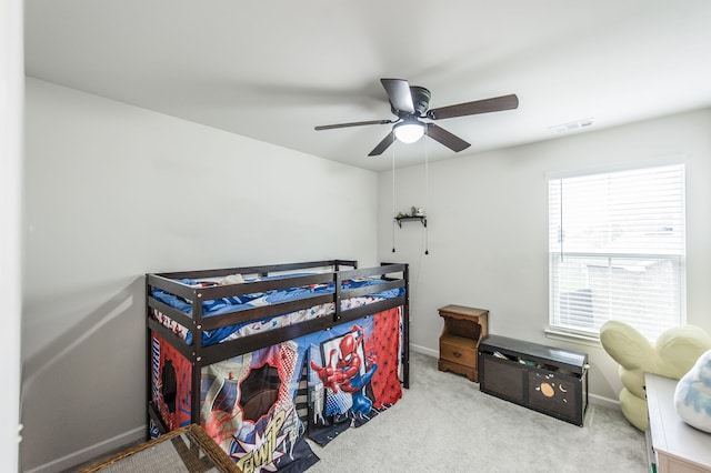 carpeted bedroom with ceiling fan