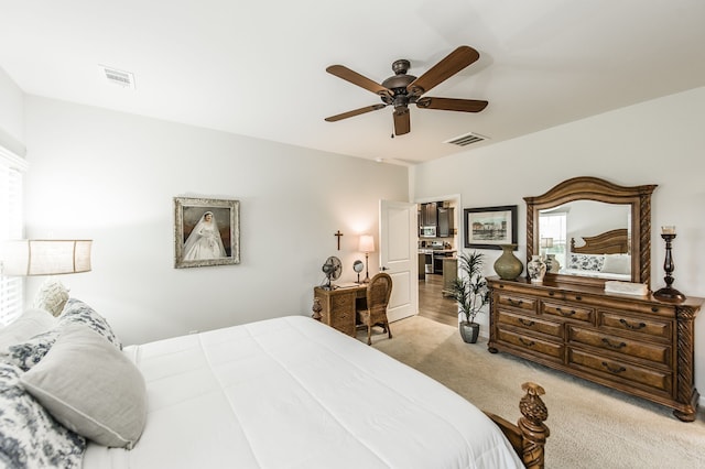 carpeted bedroom with ceiling fan