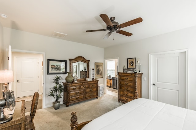 bedroom with light colored carpet and ceiling fan