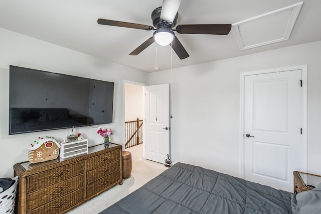 bedroom featuring light colored carpet and ceiling fan