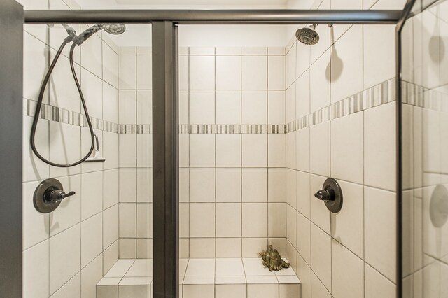 bathroom with a tile shower