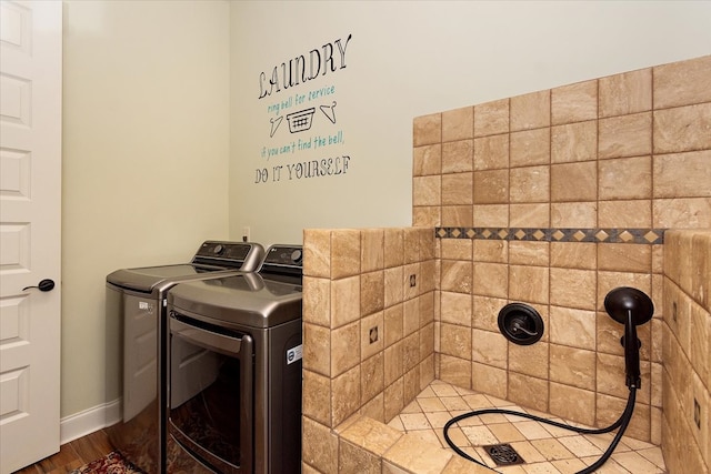 laundry room featuring hardwood / wood-style flooring and independent washer and dryer