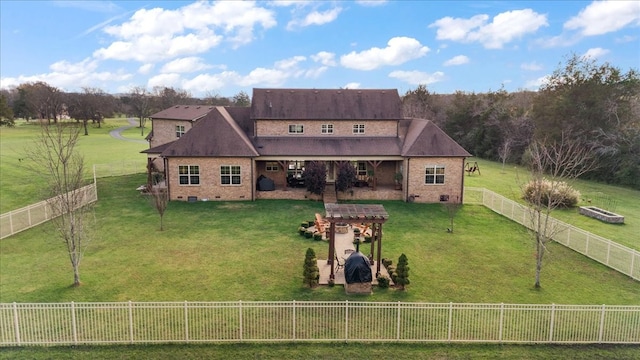 rear view of property with a yard