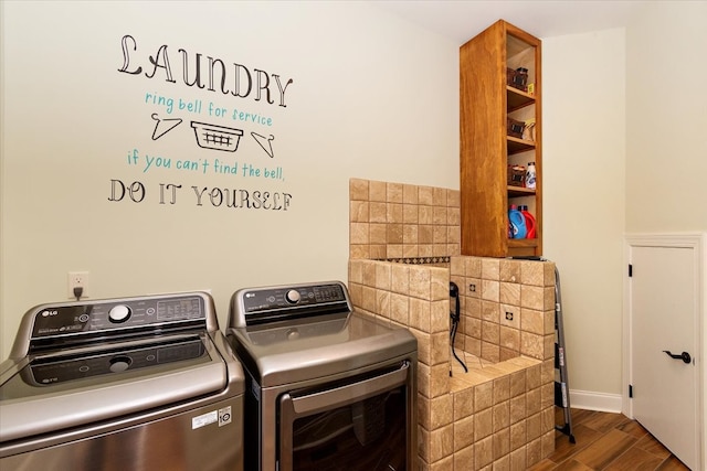 clothes washing area featuring separate washer and dryer and dark wood-type flooring