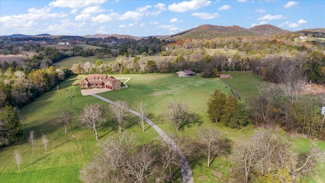 drone / aerial view featuring a mountain view and a rural view