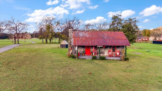 view of outbuilding with a lawn