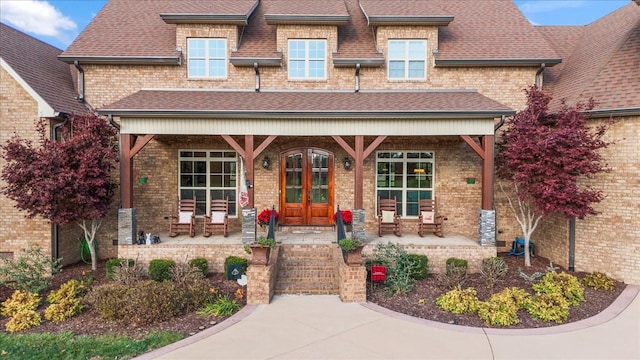 view of front of property featuring a porch and french doors