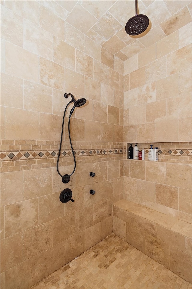 bathroom featuring tiled shower