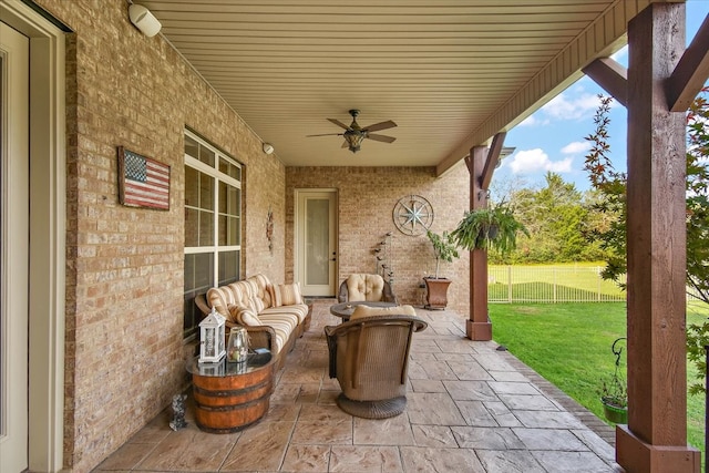 view of patio with outdoor lounge area and ceiling fan