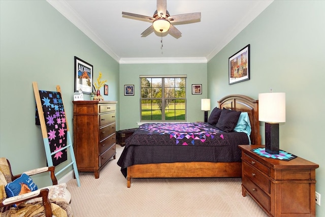 bedroom featuring light carpet, ceiling fan, and crown molding