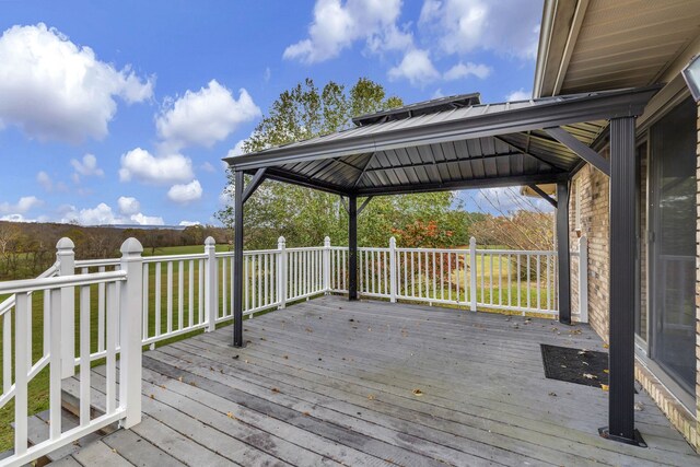 wooden deck featuring a gazebo