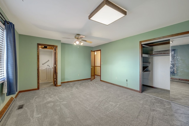 unfurnished bedroom featuring a closet, light colored carpet, ceiling fan, and a baseboard heating unit