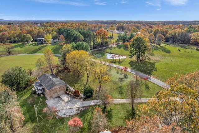 birds eye view of property with a water view and a rural view