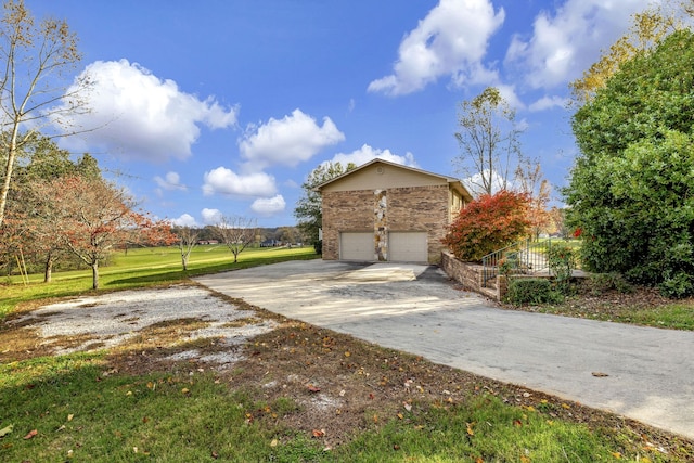 view of side of home with a garage