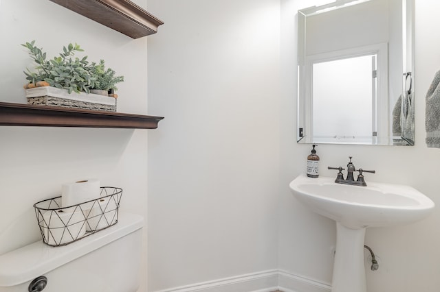 bathroom with sink and toilet