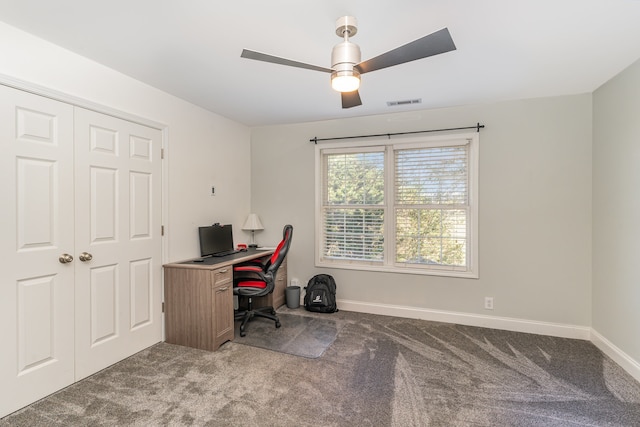 carpeted home office with ceiling fan