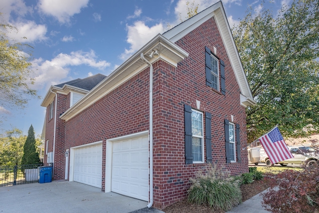 view of side of property with a garage