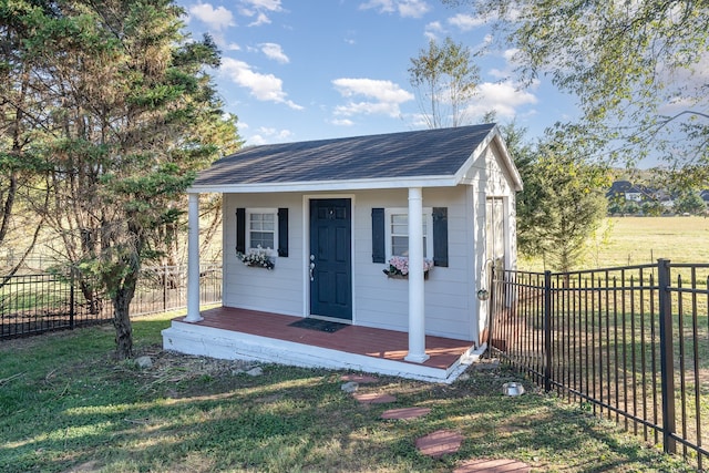 view of outbuilding with a yard