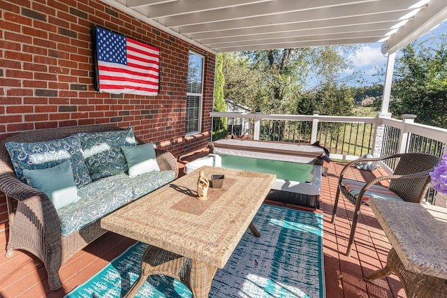 deck featuring an outdoor hangout area and a covered hot tub