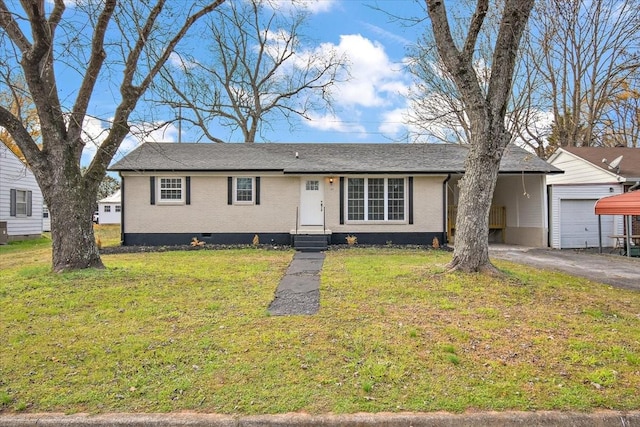 ranch-style house featuring a front yard and a garage