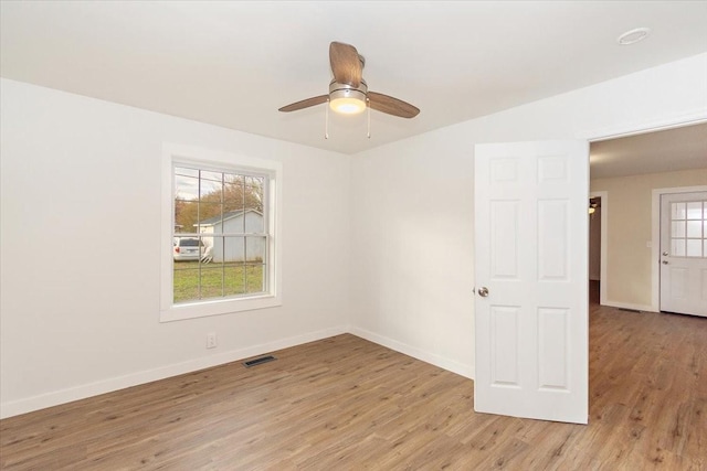 unfurnished room with ceiling fan and light hardwood / wood-style flooring