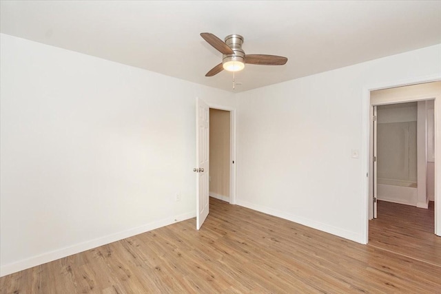 unfurnished room with ceiling fan and light wood-type flooring