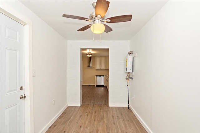 hallway featuring light hardwood / wood-style flooring and water heater