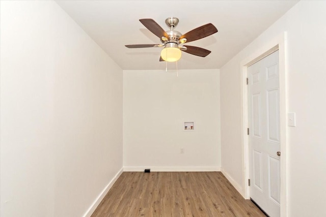 laundry area with hookup for a washing machine, light wood-type flooring, and ceiling fan