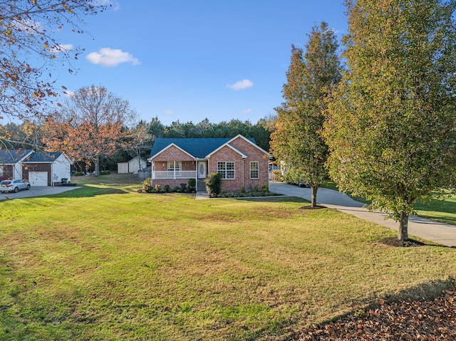 view of front of property featuring covered porch and a front lawn