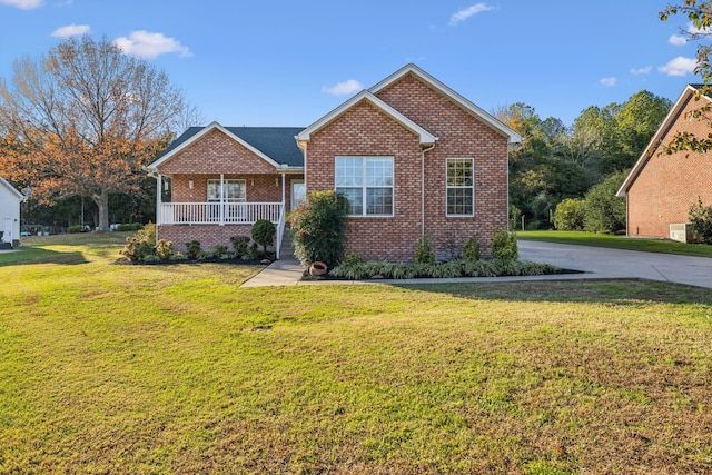 view of front property with covered porch and a front lawn