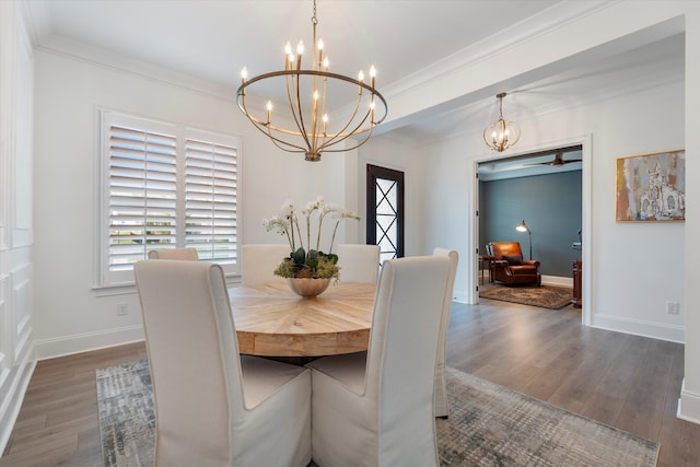 dining room with dark hardwood / wood-style floors, ceiling fan, and ornamental molding