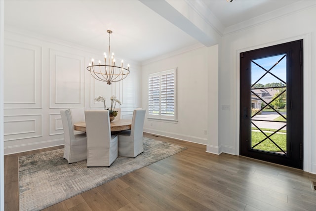 unfurnished dining area with a chandelier, wood-type flooring, and a healthy amount of sunlight