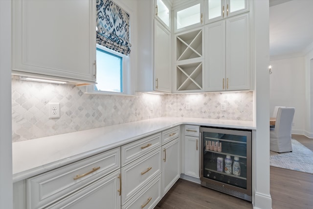 kitchen featuring hardwood / wood-style flooring, white cabinetry, and beverage cooler