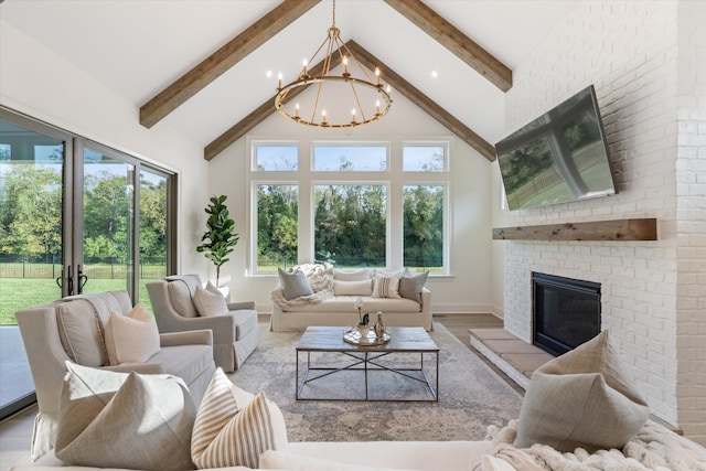 sunroom featuring vaulted ceiling with beams, a healthy amount of sunlight, a chandelier, and a brick fireplace