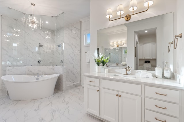 bathroom featuring plus walk in shower, vanity, tile walls, and a notable chandelier