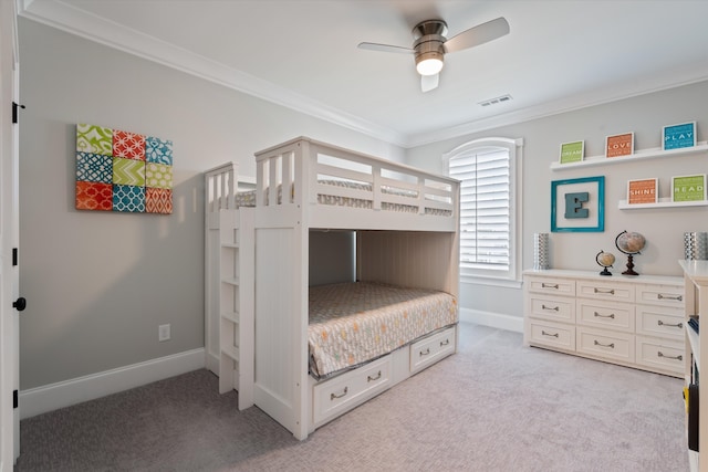 bedroom featuring ceiling fan, light colored carpet, and ornamental molding