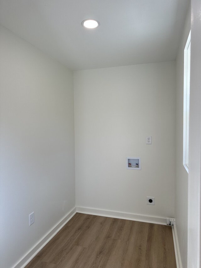 laundry room with hardwood / wood-style floors, hookup for an electric dryer, and washer hookup