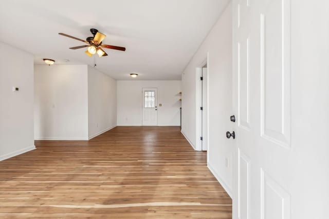 foyer entrance featuring ceiling fan and light hardwood / wood-style flooring