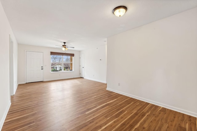 spare room featuring ceiling fan and hardwood / wood-style flooring