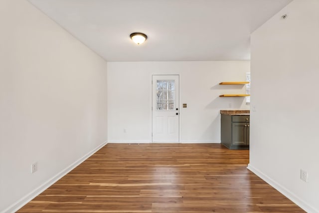 interior space with dark hardwood / wood-style flooring